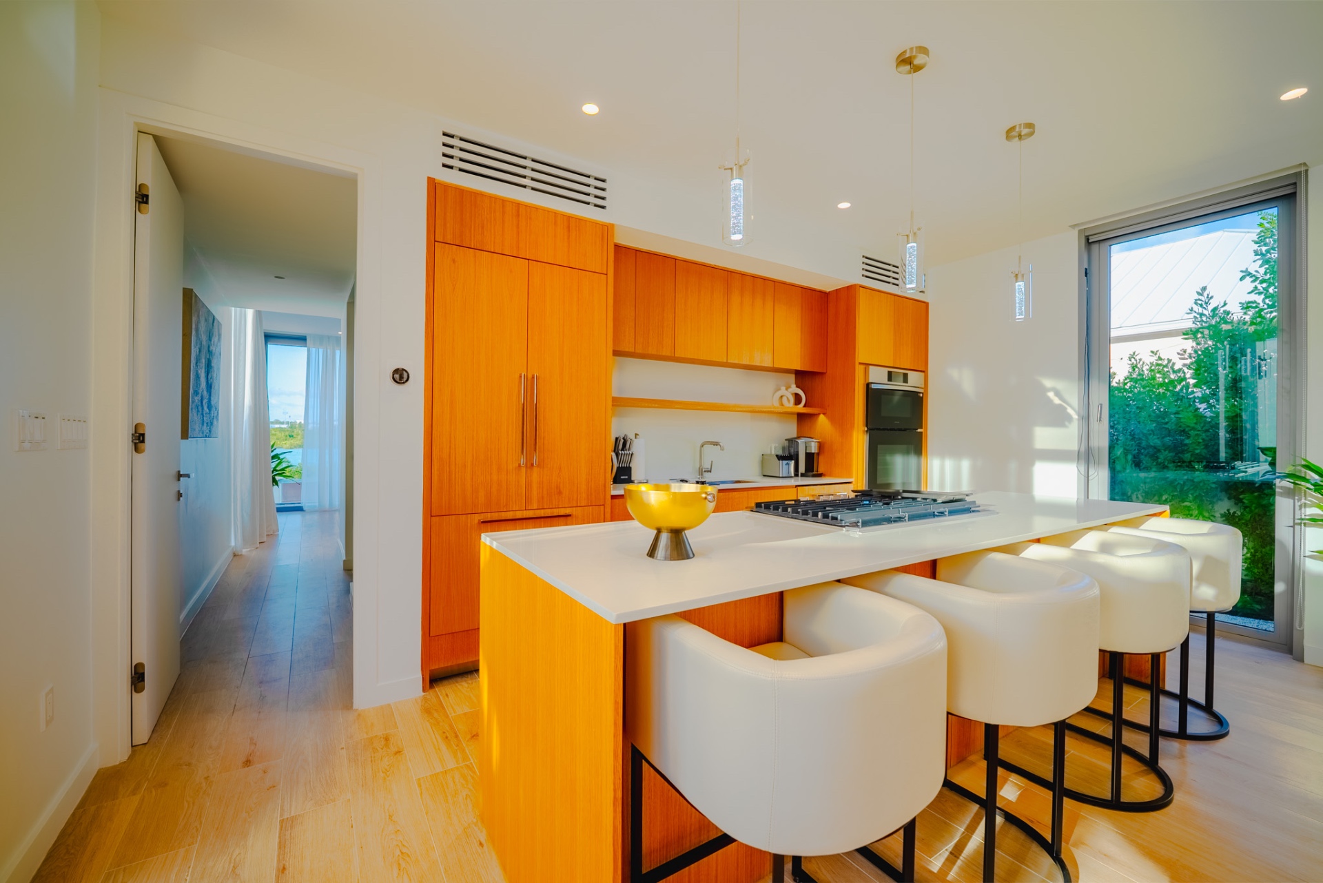 Bright wood kitchen with island seating at Villa Cyan