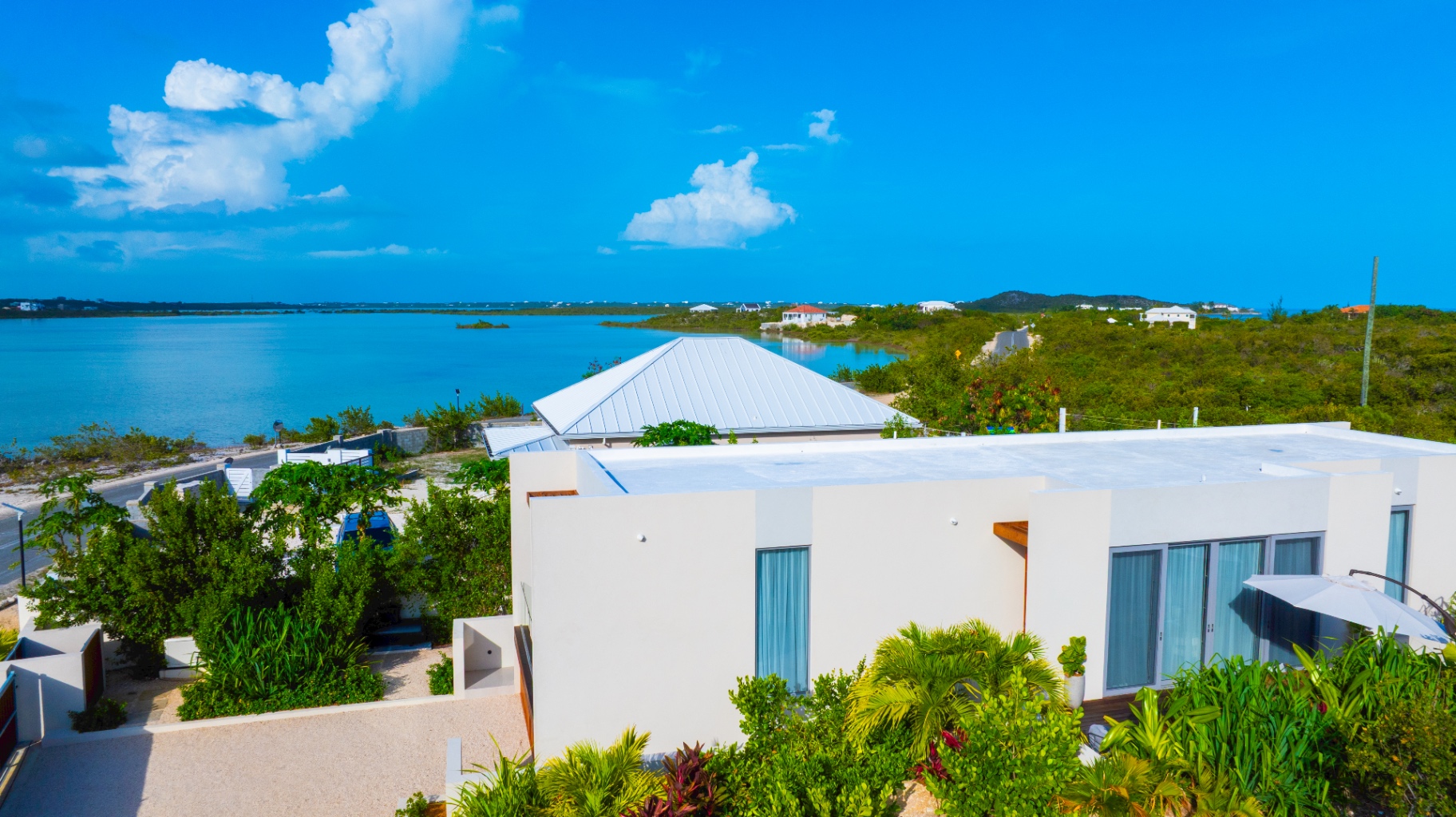 Aerial view of Villa Cyan and the turquoise waters of Turtle Tail