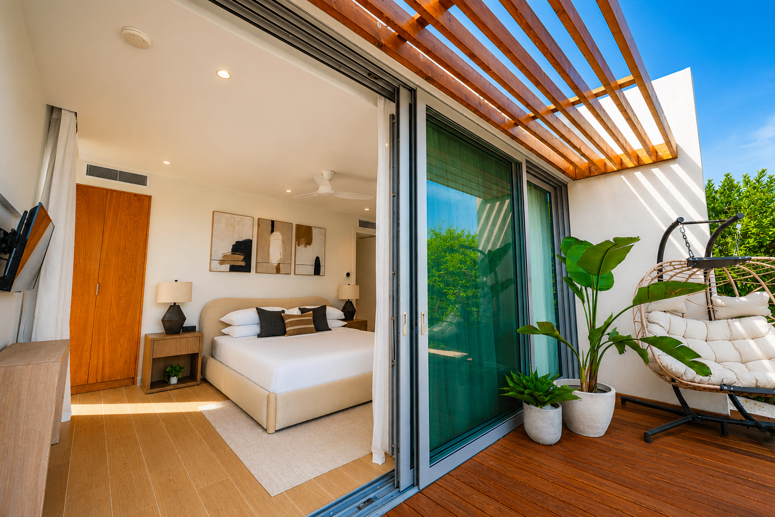 Second bedroom with a pergola-covered deck and hanging chair