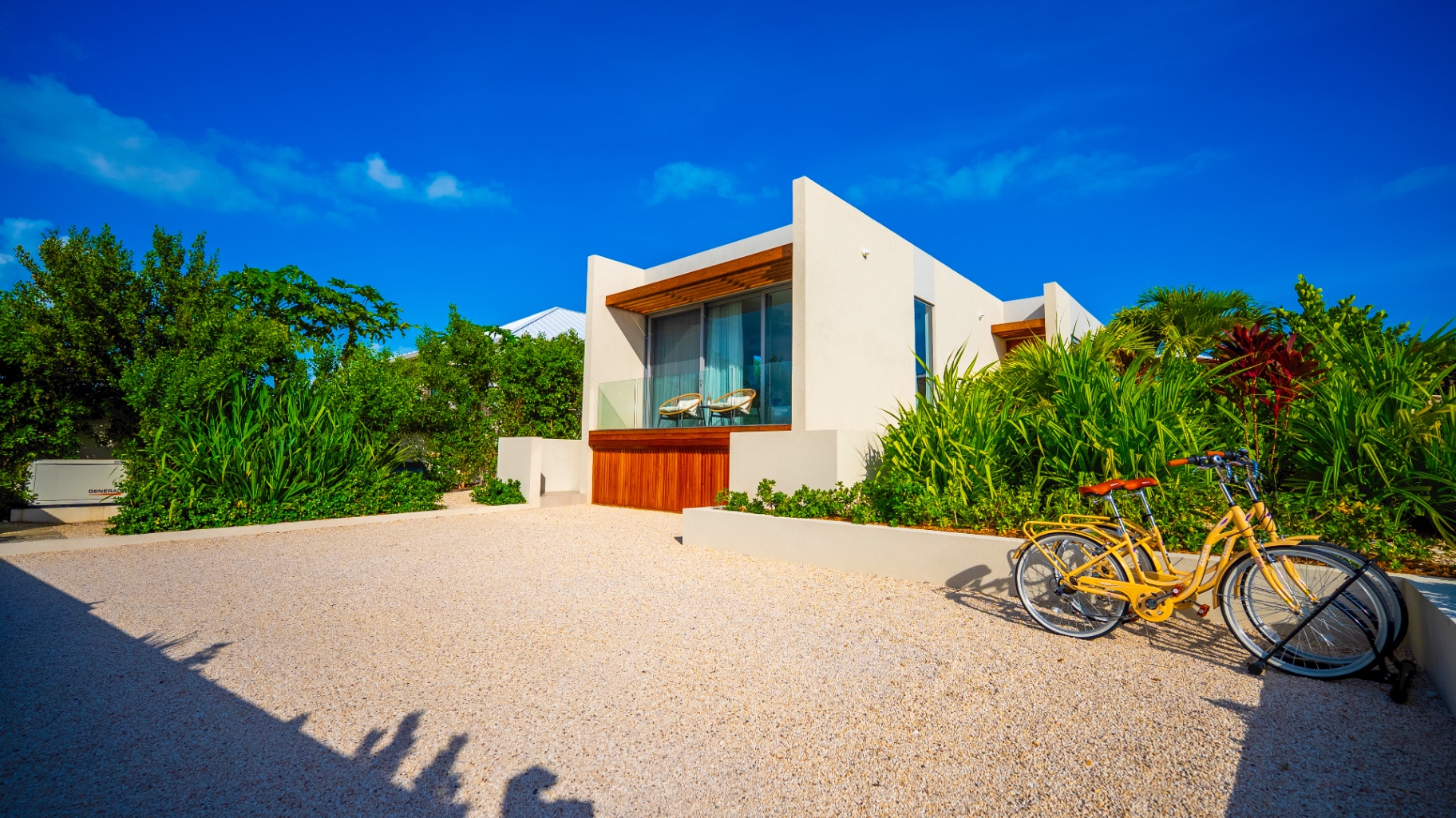 Private parking bay, Villa Cyan exterior, and guest bicycles